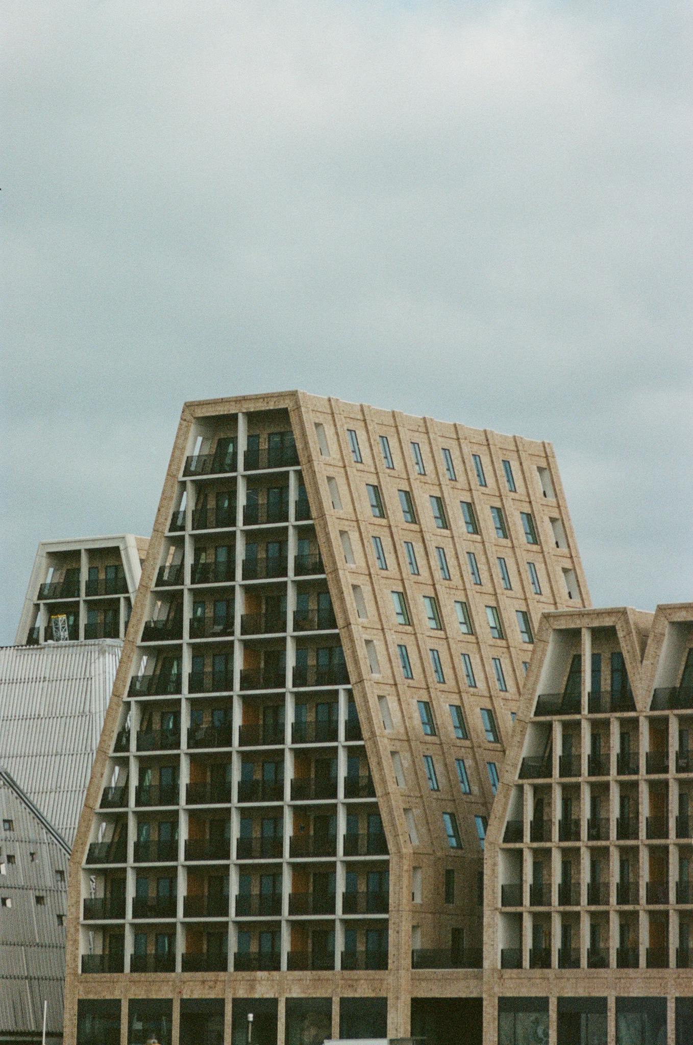 Modern exterior view of Scandinavian architectural design with unique geometric shapes.